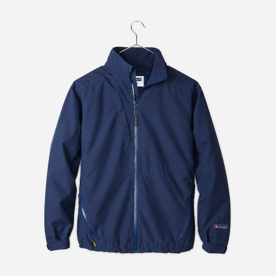 Boathouse Women's Waterproof Barrier Jacket in Navy, front view on a chrome hanger