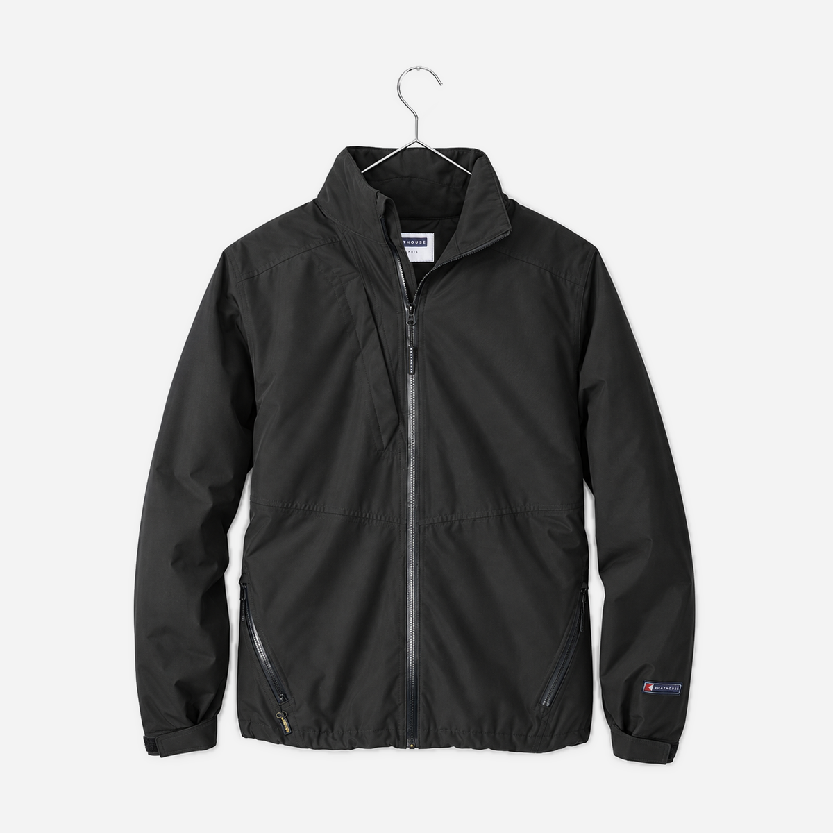 Boathouse Women's Waterproof Barrier Jacket in Black, front view on a chrome hanger