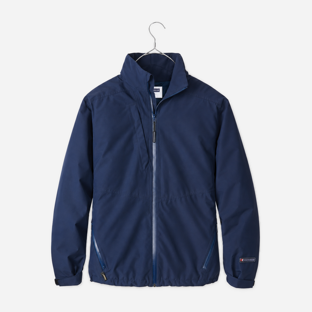 Boathouse Men's Waterproof Barrier Jacket in Navy, front view on a chrome hanger