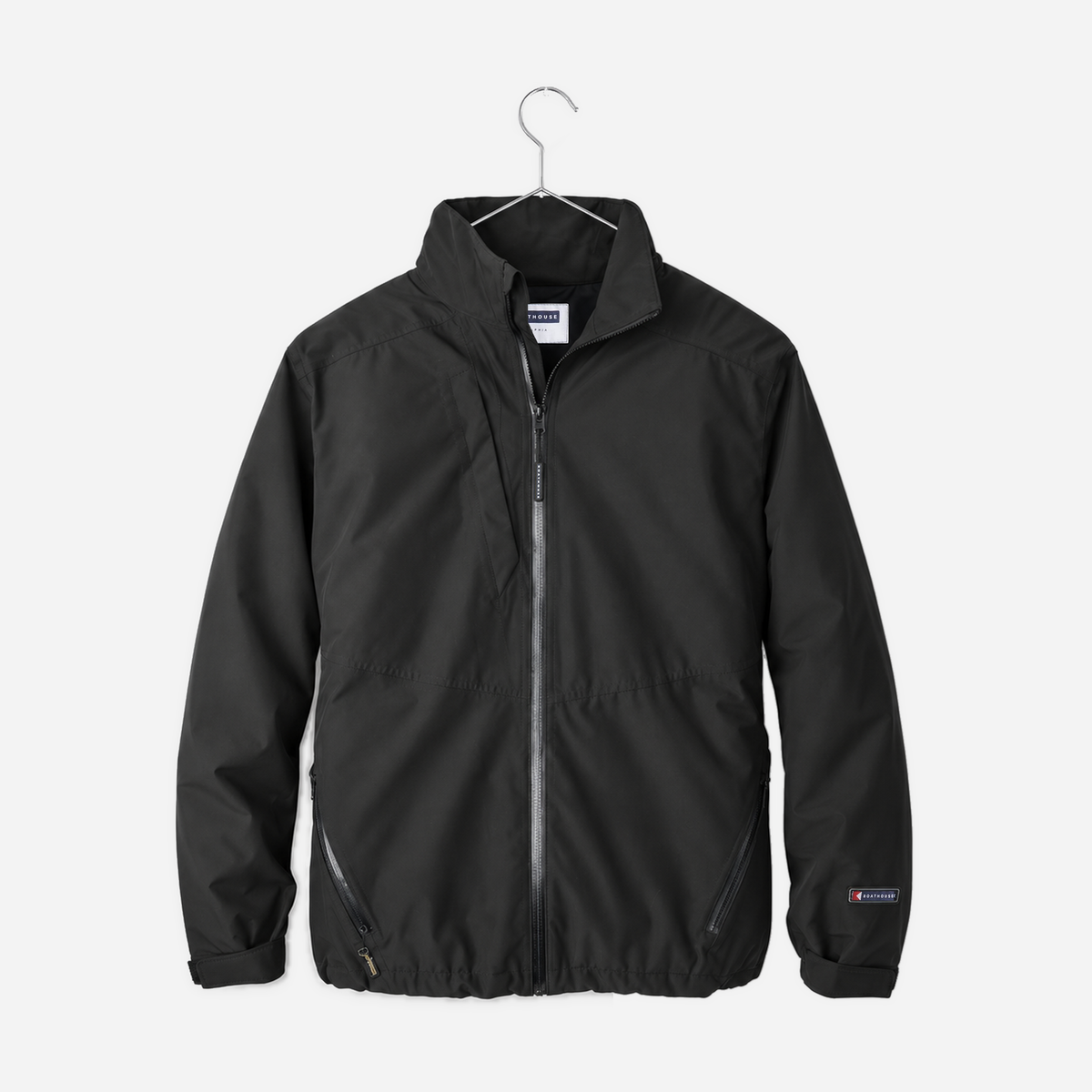 Boathouse Men's Waterproof Barrier Jacket in Black, front view on a chrome hanger