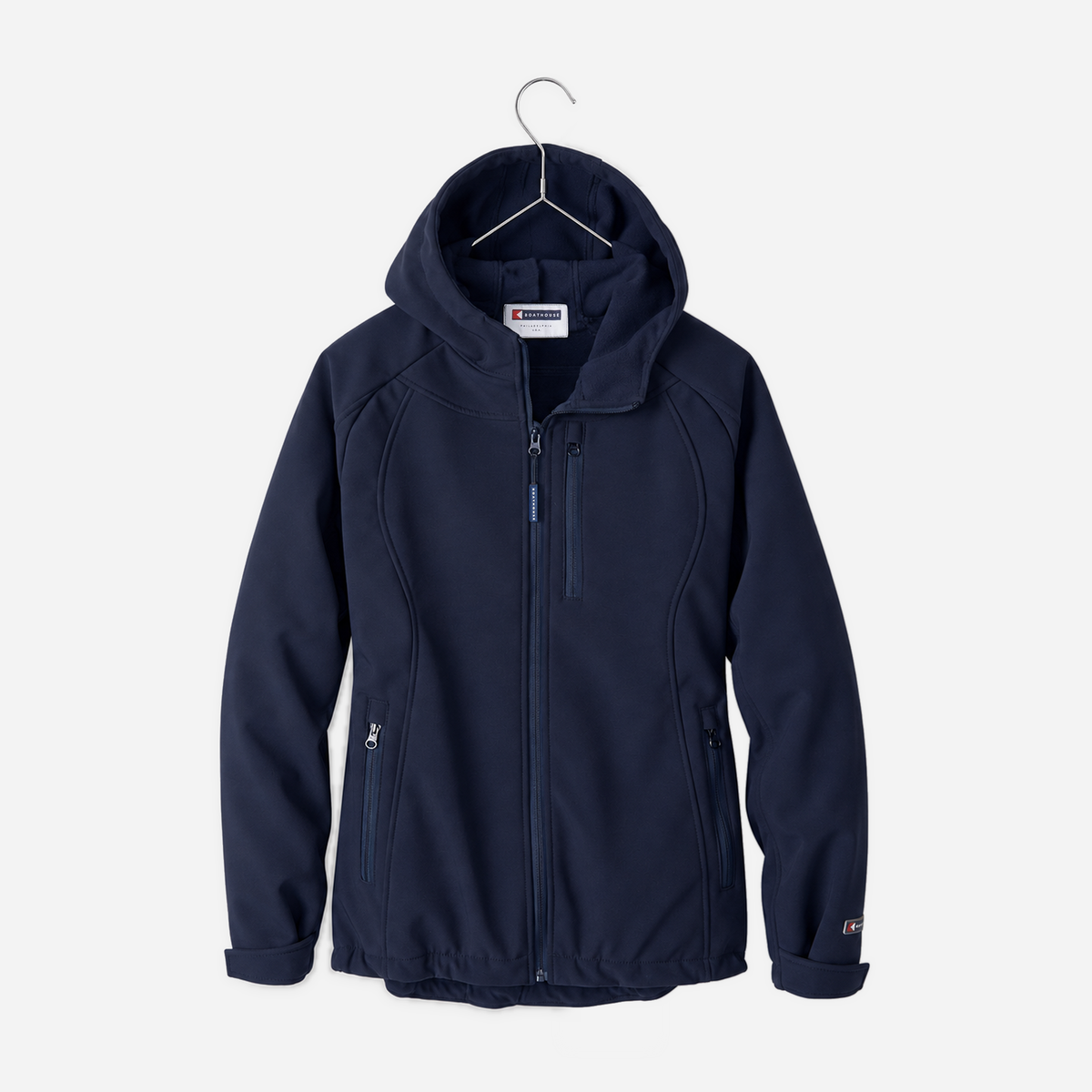 Boathouse Women's Elevate Soft Shell Jacket in Navy, front view on a chrome hanger