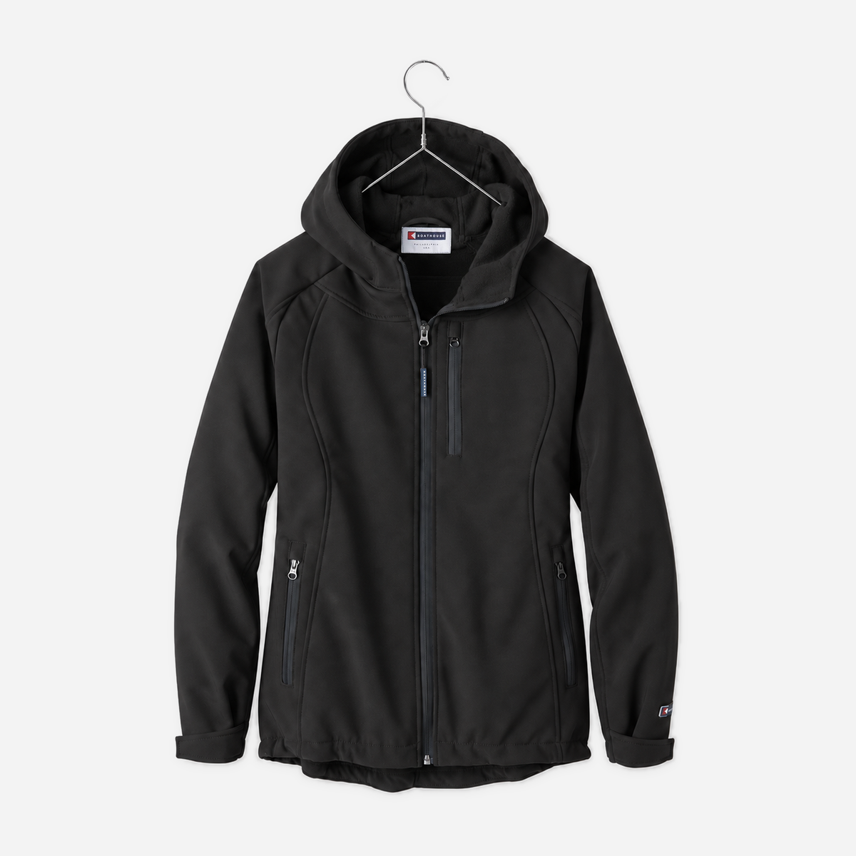 Boathouse Women's Elevate Soft Shell Jacket in Black, front view on a chrome hanger