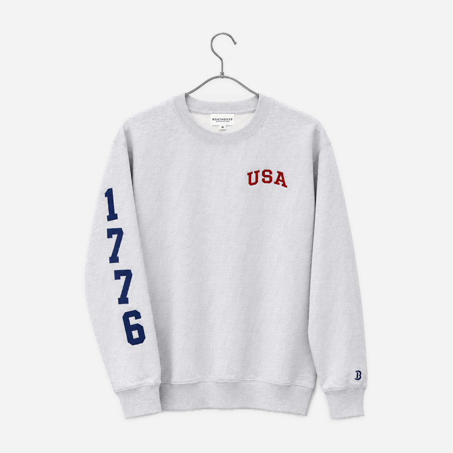 Boathouse USA 1776 Crew Sweatshirt in Grey, front view on a chrome hanger