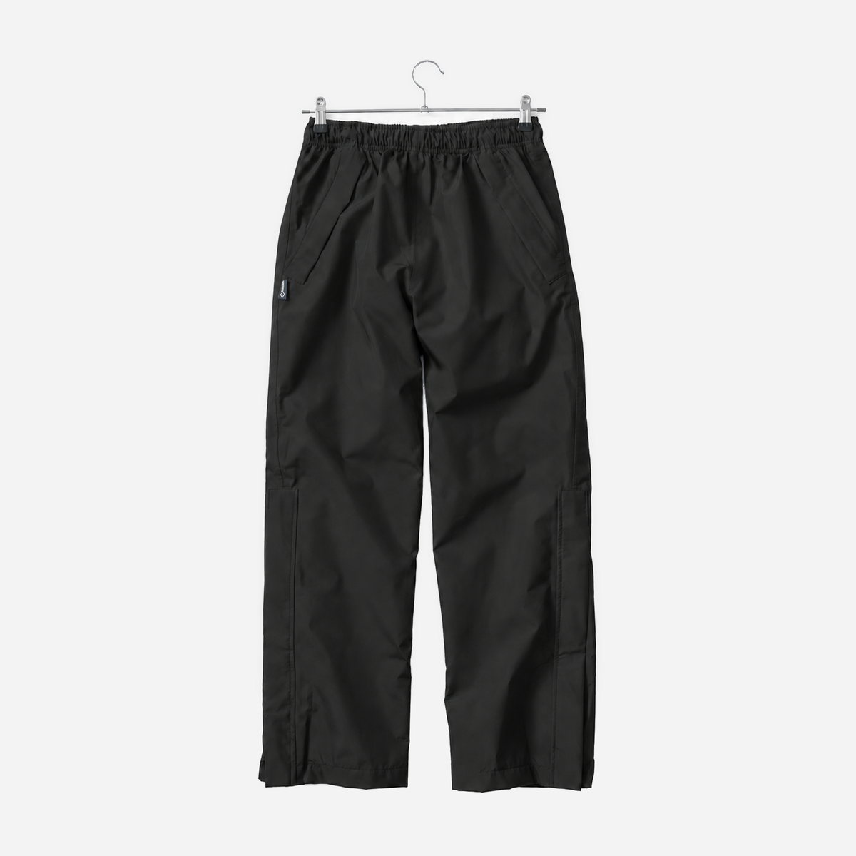 Boathouse Men's Waterproof Pants in Black, front view on a chrome hanger