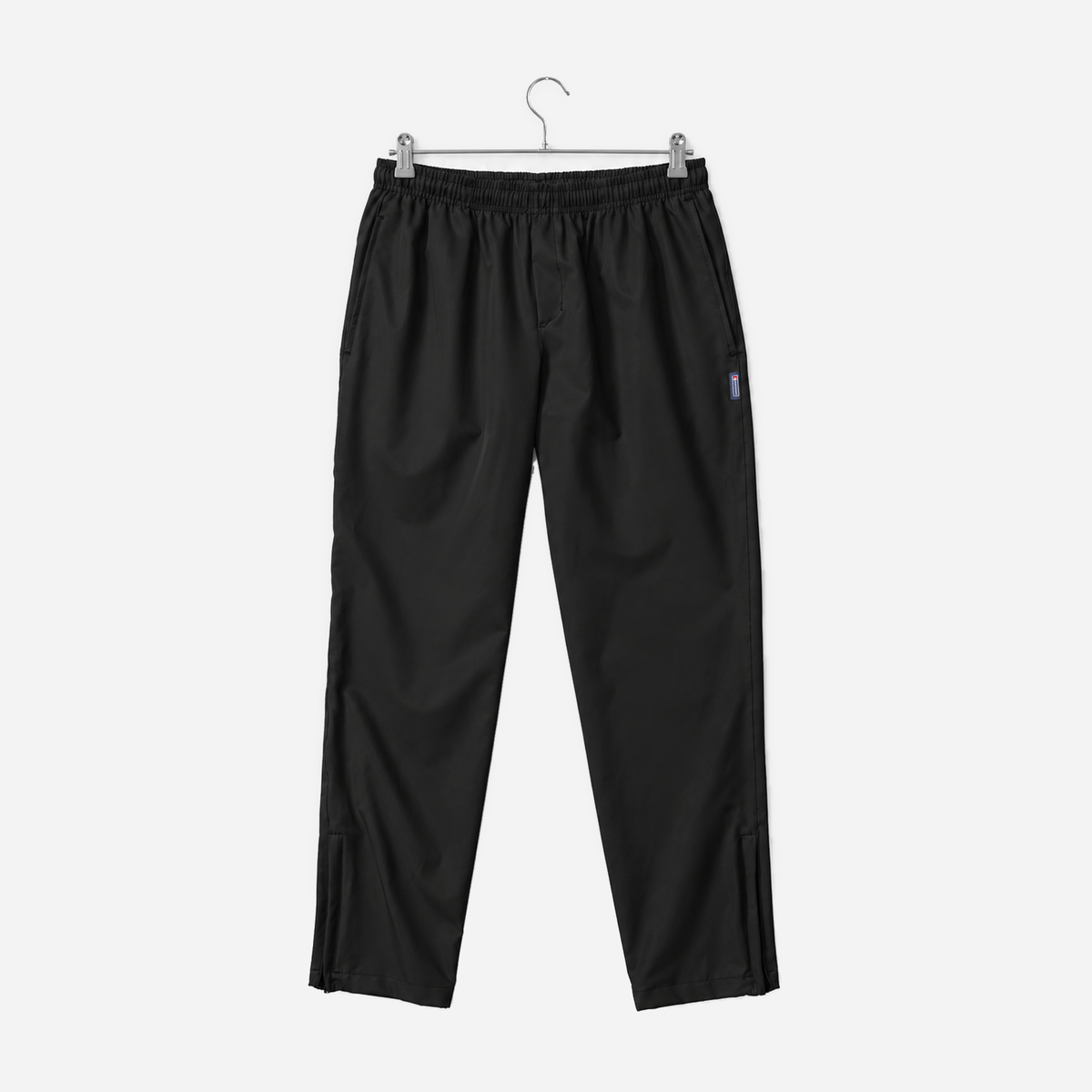 Boathouse Men's Journey Pants in Black, front view on a chrome hanger