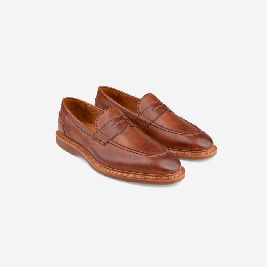 Pair of Allen Edmonds Randolph Verse penny loafers in Chili Leather, three-quarter view